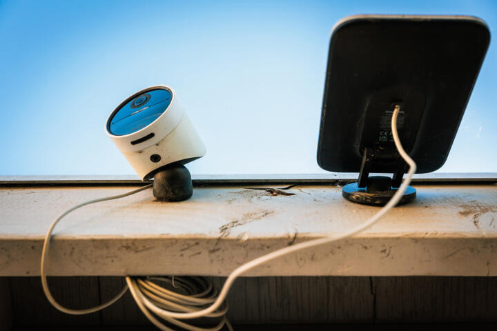 Closeup photograph of a SimpliSafe Camera on a roof